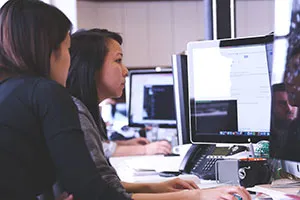 Woman staring at computer screen