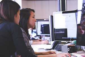 Woman staring at computer screen